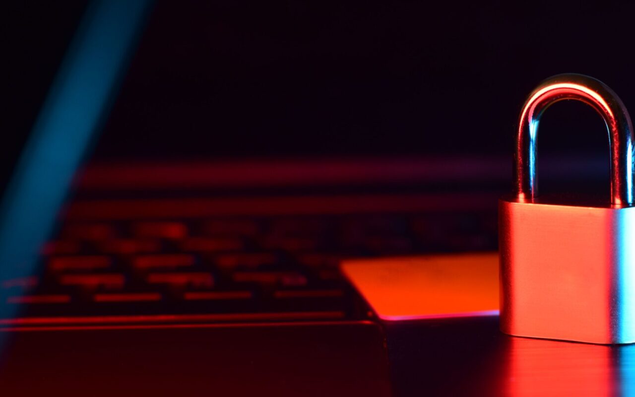 Padlock on laptop keyboard representing password and device security